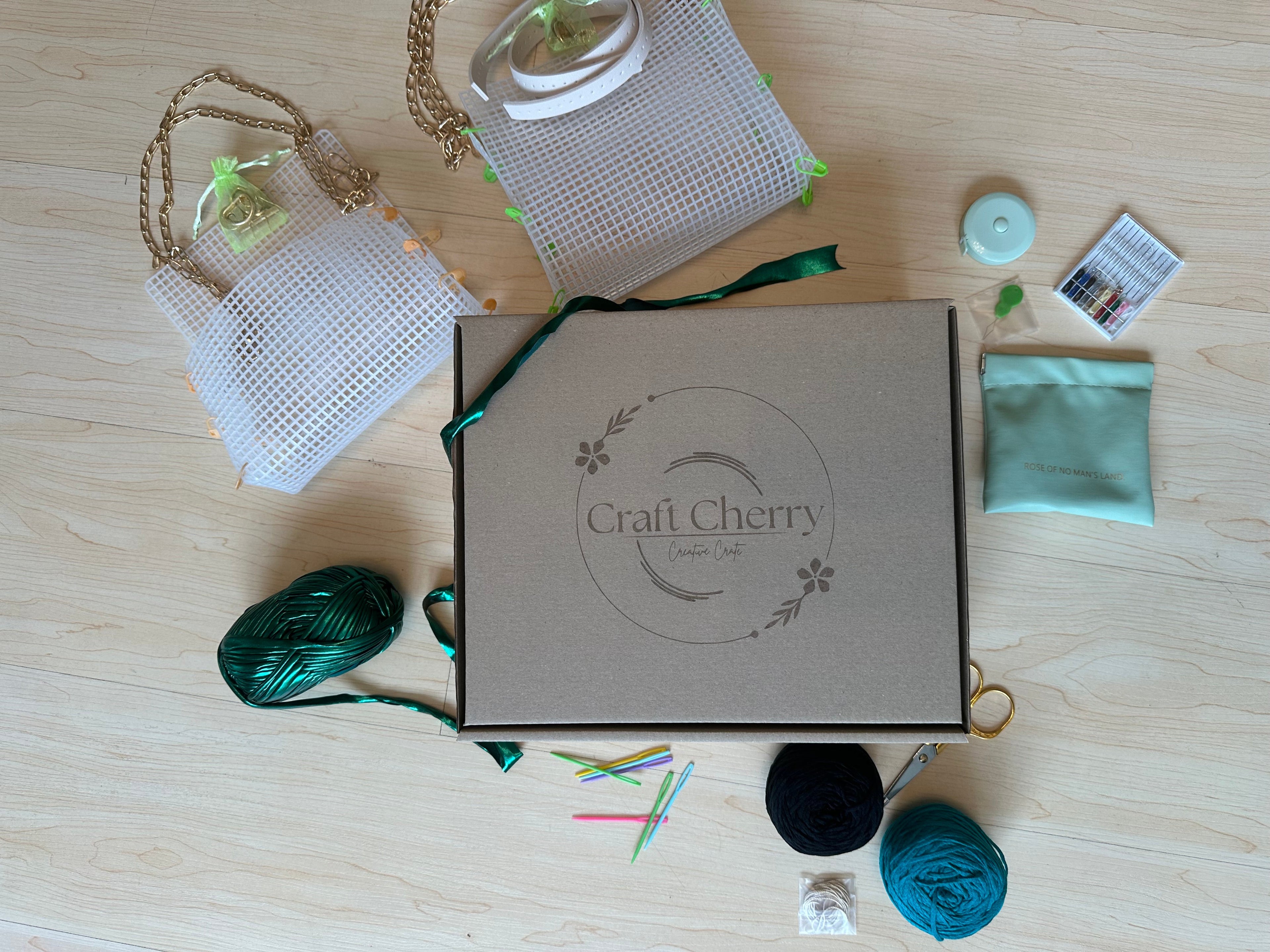 Craft Cherry box with yarn, bag canvas, and other crafting materials.